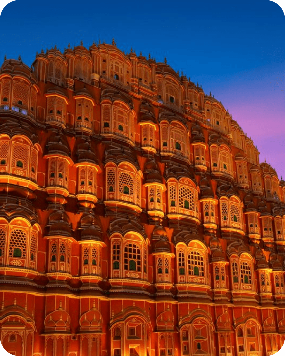 Hawa Mahal lit up against the evening sky